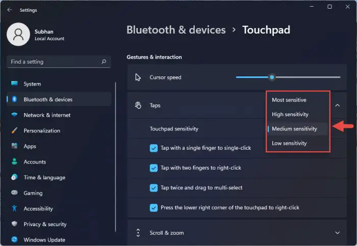 Choose touchpad tap sensitivity